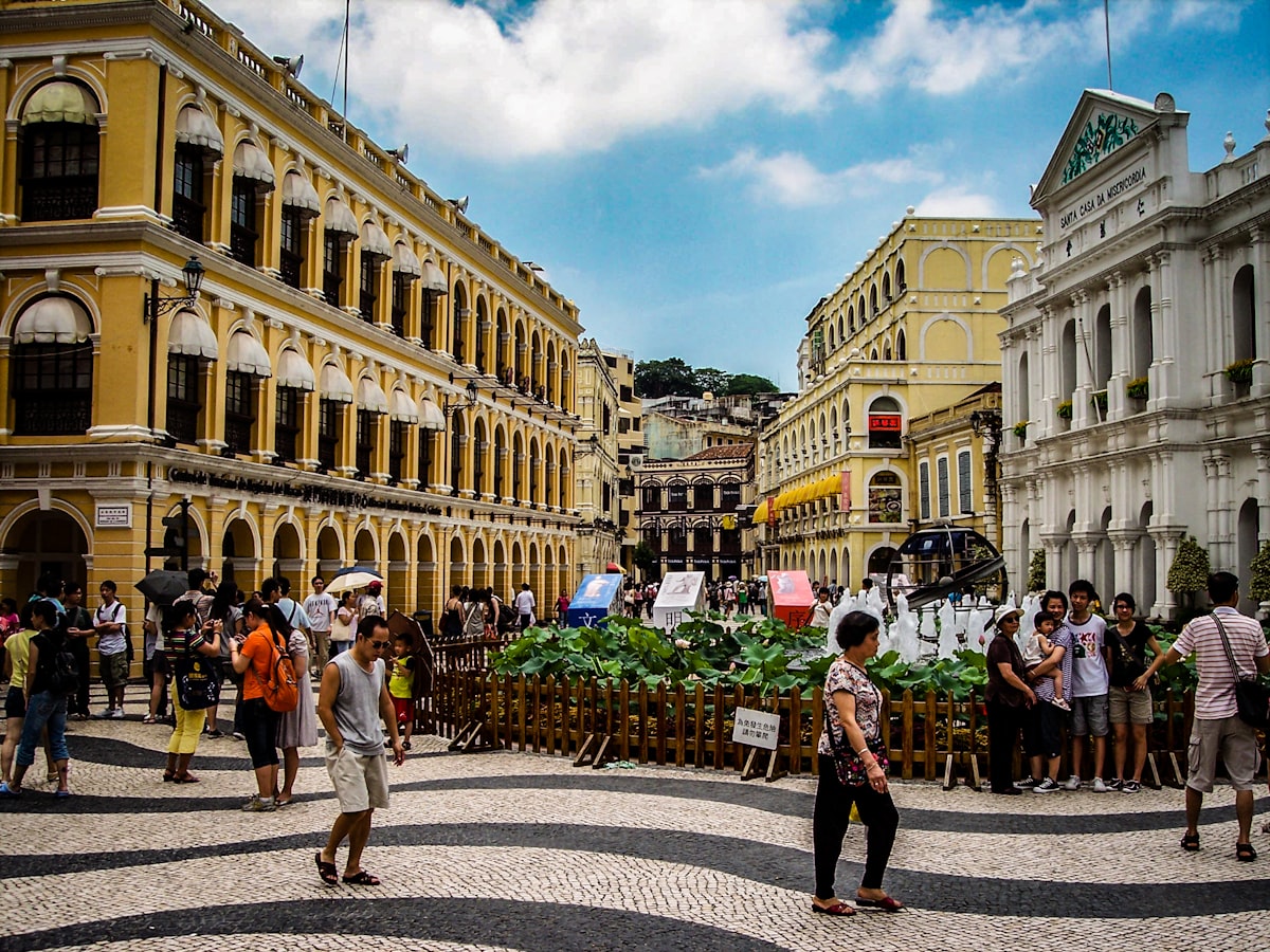 Senado Square in Macau — wave-patterned cobblestone mosaic and pastel Portuguese colonial buildings